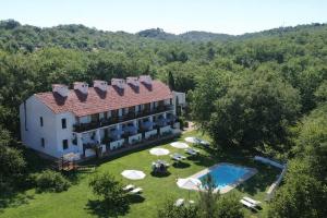 an aerial view of a house with a swimming pool at Hotel Apartamento Rural Finca La Media Legua in Aracena