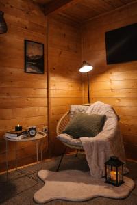 a room with a bed and a lamp and a table at Green Top Durmitor in Žabljak +37 photos
