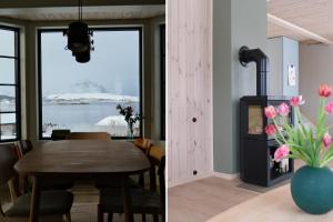 a dining room with a table and a vase of pink tulips at Seaview Country House in Pettvik