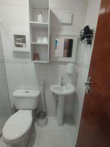 a white bathroom with a toilet and a sink at Recanto Vista Mar - Costa Verde, Mangaratiba in Mangaratiba +14 photos