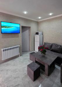 a living room with a couch and a table at Livana Guesthouse - Goris in Goris