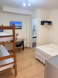 Foto de AP Studio Central 8 min do Paraguai - Ar e Garagem - Casasdimae