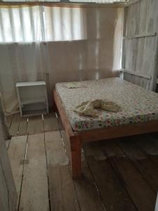 a small room with a bed with a mattress at Cabaña Luna Nueva in Buenaventura