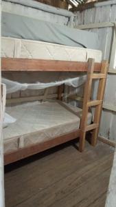 a couple of bunk beds in a room at Cabaña Luna Nueva in Buenaventura