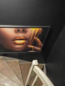 a picture of a woman with a picture of herself at Fleur de Lune in Amiens