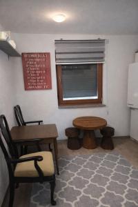 a room with a table and a table and a window at Edi in Sarajevo