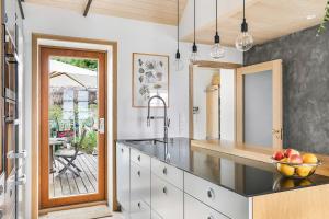 a kitchen with a sink and a bowl of fruit on the counter at Villa house in Son Old Town - Oslo Fjord in Vestby