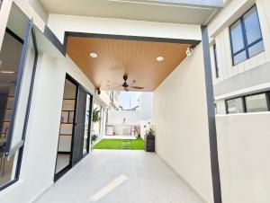 a hallway of a house with a ceiling fan at Mallow Semi-D homestay in Rawang +12 photos