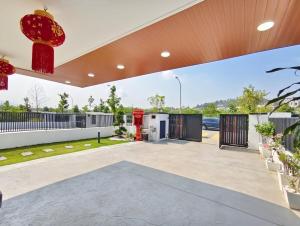 a garage with a red fire hydrant in a building at Mallow Semi-D homestay in Rawang