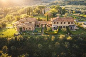an aerial view of a large house in a field at la villa bella vista in Castelmuzio