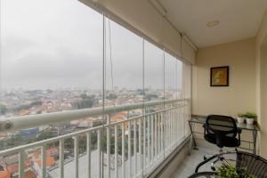 a balcony with a view of a city at Lovely Studio - GRU 1613 in Guarulhos
