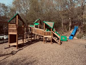 a group of playground equipment in a park at Chalet AchiLou in Durbuy
