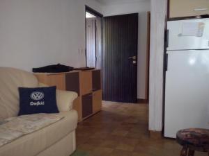 a living room with a couch and a refrigerator at Apartment Stinica 26 E in Jablanac