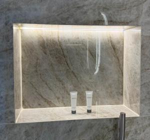 a shower with two cups on a counter in a bathroom at Aliki Studios in Parga +73 photos