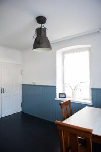 a kitchen with a table and a window at Pim's in Steffeln