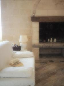 
a room with a bed and a fireplace at Ai Sassi di Pietro in Matera
