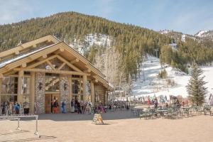 a group of people standing outside of a ski lodge at Evergreen Condo 26 in Ketchum