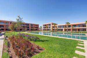 an image of a swimming pool at a apartment complex at Noria Golf Apartment in Marrakesh