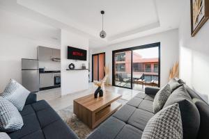 a living room with a couch and a table at Noria Golf Apartment in Marrakesh