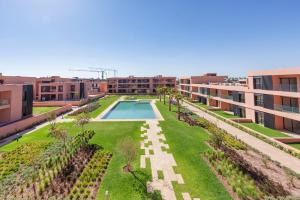an aerial view of the courtyard of a building with a swimming pool at Noria Golf Apartment in Marrakesh