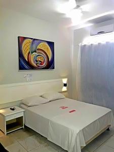 Ένα ή περισσότερα κρεβάτια σε δωμάτιο στο Hotel Planalto 2