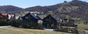 a group of houses on top of a hill at Villa Ensari Jezerc in Ferizaj