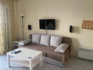 a living room with a couch and a table at michelangela in Ireon +17 photos