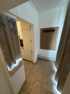 a bathroom with a shower and a tile floor at Cozy Ground Floor Apartment Near U6 Easy Access to Center in Vienna +27 photos