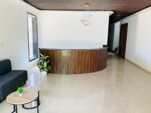 a lobby with a reception desk in a building at Origin Suites Luxury Boutique Hotel Pushkar in Pushkar