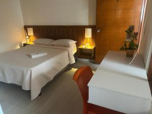 a bedroom with a bed and a bath tub at La Casona in Arauca