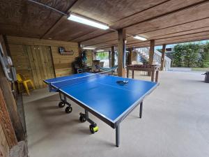 a ping pong table in the middle of a room at Pelican's Perch in Santa Rosa Beach