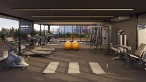 a gym with treadmills and machines in a building at Apartamento de Luxo 2 Quartos, Brasília - Get Park Sul - com Garagem in Brasília