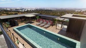 an overhead view of a swimming pool on a building at Apartamento de Luxo 2 Quartos, Brasília - Get Park Sul - com Garagem in Brasília