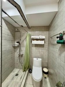 a bathroom with a toilet and a shower at Silver 34 Boutique in Tbilisi City +80 photos