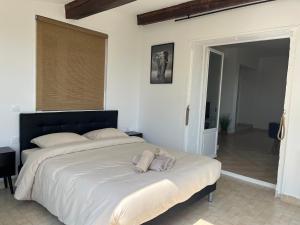 a bedroom with a large bed with towels on it at French Riviera near Nice Monaco, Apartments in Villa, Sea Montain View in Carros
