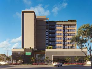 a rendering of a building with a car parked in front at Apartamento de Luxo 2 Quartos, Brasília - Get Park Sul - com Garagem in Brasília