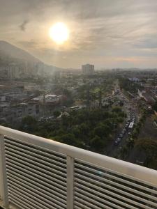 a view of a city from a balcony at Aparthotel diamond flat in Nova Iguaçu