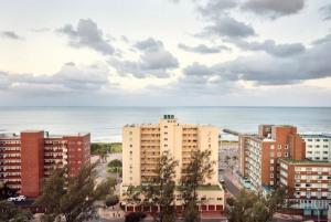 a city with buildings and the ocean in the background at Durban Oceanic Apartment 117 in Durban