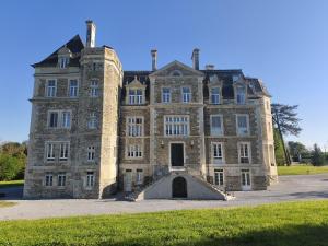 an old castle with a gate in front of it at ChâtEscos - Estudio en Château in Escos