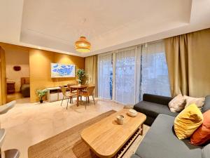 a living room with a couch and a table at Modern and cozy CFC apartment in Casablanca