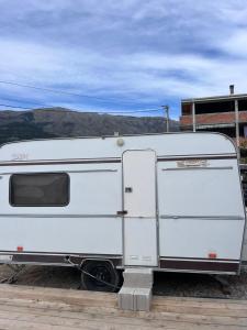 a white trailer parked on the side of a road at A little paradise 2 in Radanovići +1 photo