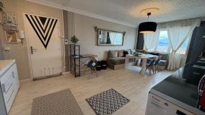 a living room with a couch and a table at Bellevue in Colmar +16 photos