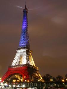 a view of the eiffel tower lit up at night at Love appart Parisienne in Villeneuve-Saint-Georges +2 photos