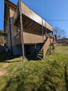 a house with a deck on the side of it at Steneryd Salongen in Karlskrona +6 photos