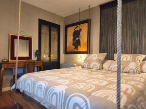 a bedroom with a swinging bed and a desk at ChâtEscos - Estudio en Château in Escos +36 photos