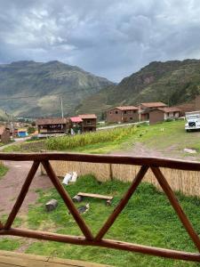 a view of a village with mountains in the background at Raíz Azul in Pisac +2 photos