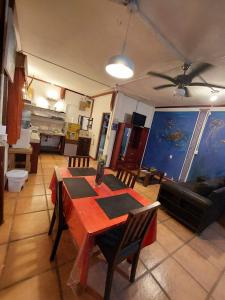 a living room with a table and a couch at Coral Lagoon in Puerto Viejo