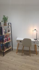 a desk with a chair next to a book shelf at Casa Loulou in Saint-Laurent-dʼAigouze +3 photos