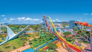 an amusement park with a roller coaster at Swallows Nest in Quarteira