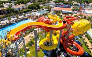 an aerial view of an amusement park with a water slide at Swallows Nest in Quarteira